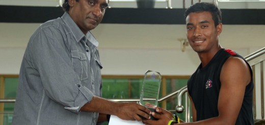 Sompal Kami receiving the man of the match award from Mr. Rumesh Ratnayake (Development officer of ACC)