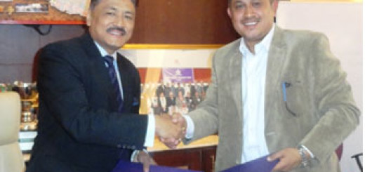 Civil Bank’s CEO Kishore Maharjan and Country Director of Sanjay Karki joining hands after signing the agreement.